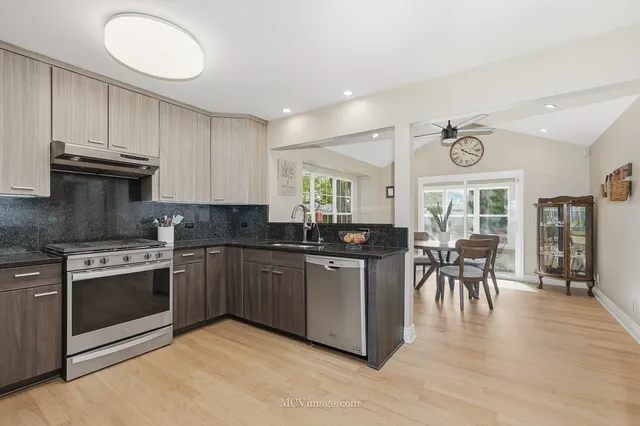 a kitchen with table and chairs