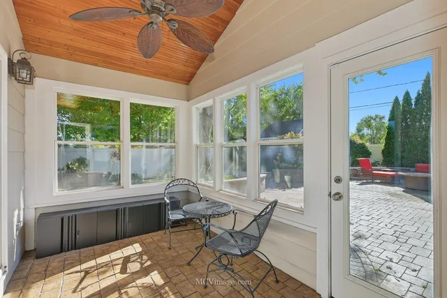 a living room with a large window and a table