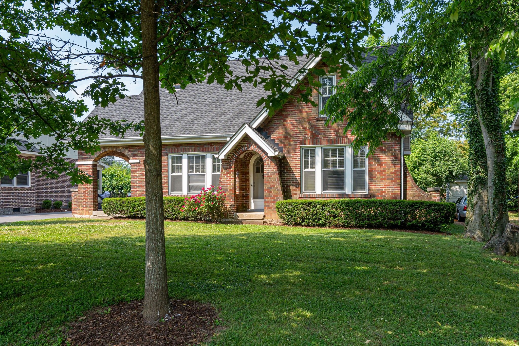 233 Cherokee Road Nashville, TN 37205 - Photo 1 of 29 a front view of a house with a yard
