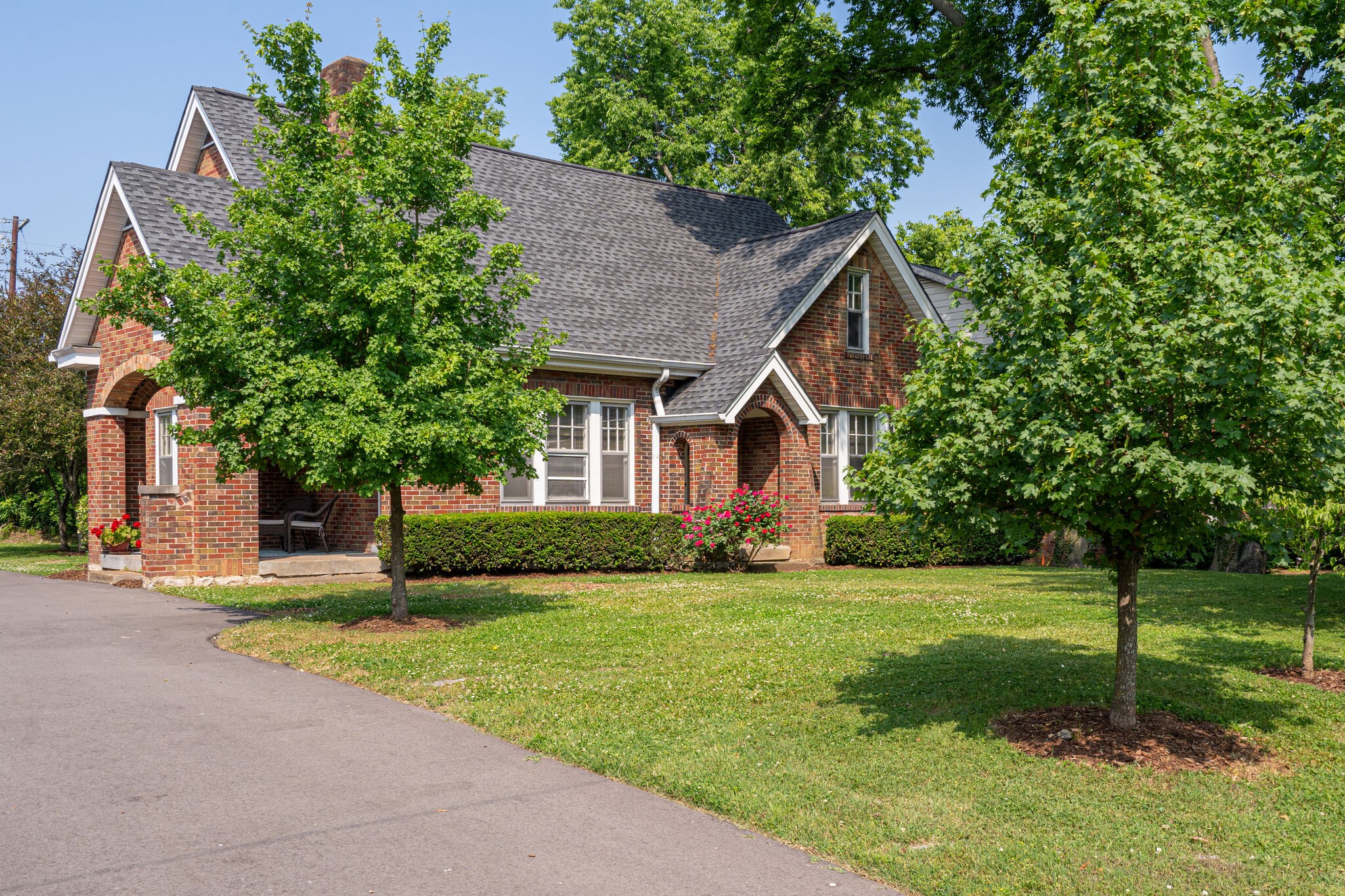 233 Cherokee Road Nashville, TN 37205 - Photo 2 of 29 a front view of a house with a yard and garage