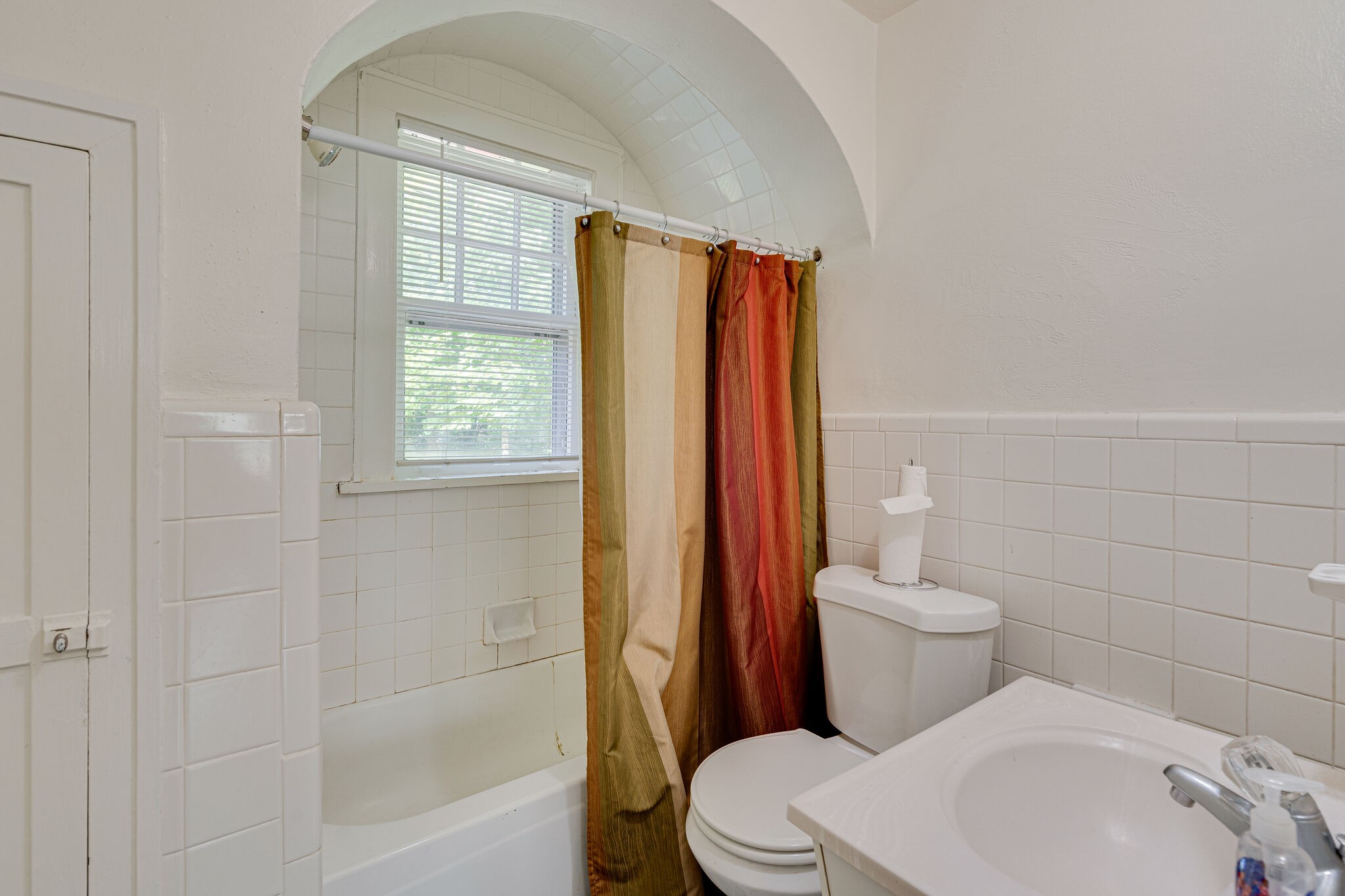 233 Cherokee Road Nashville, TN 37205 - Photo 18 of 29 a white toilet sitting next to a bathroom sink