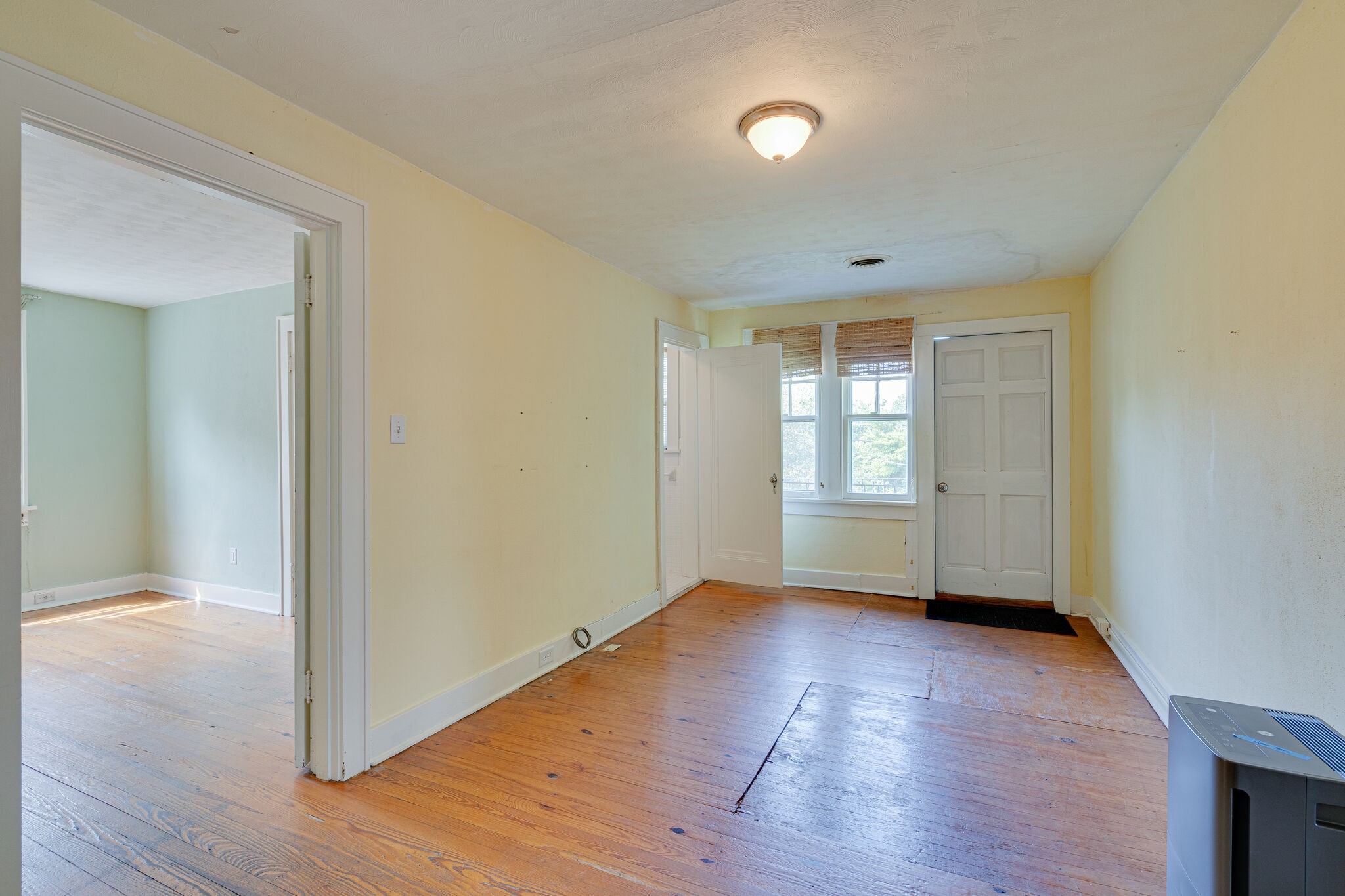 233 Cherokee Road Nashville, TN 37205 - Photo 20 of 29 a view of an empty room with wooden floor and a window
