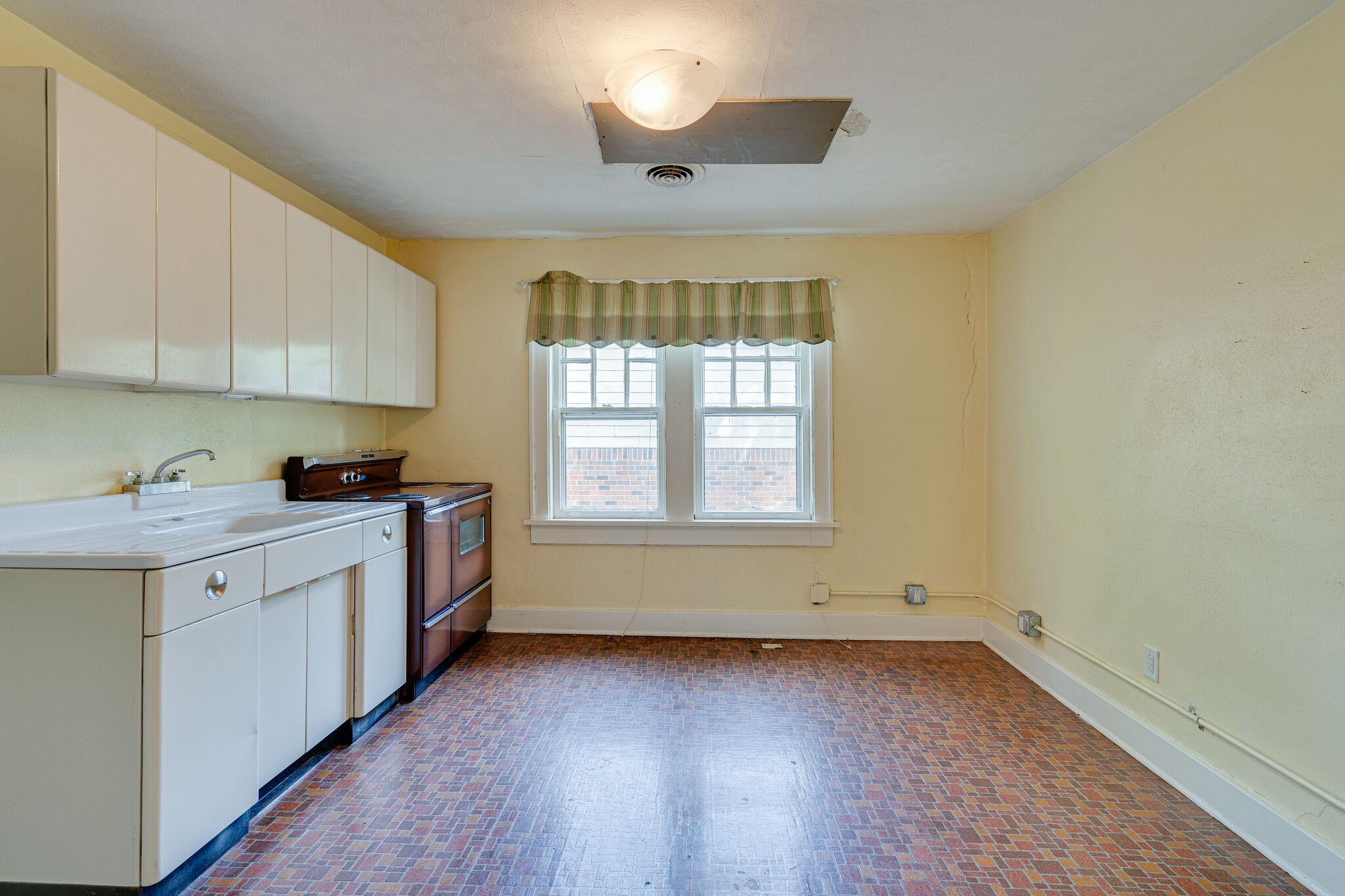 233 Cherokee Road Nashville, TN 37205 - Photo 26 of 29 a view of a kitchen with a sink dishwasher and wooden floor