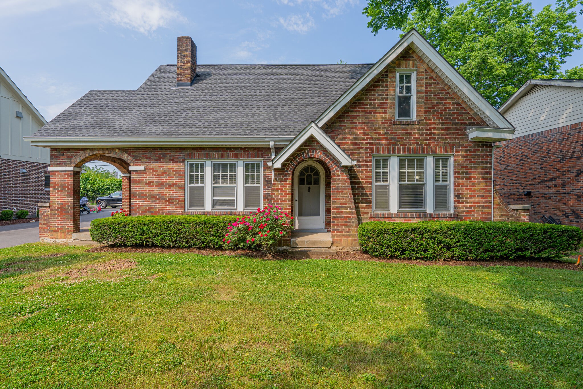 233 Cherokee Road Nashville, TN 37205 - Photo 4 of 29 a front view of a house with a yard and garage