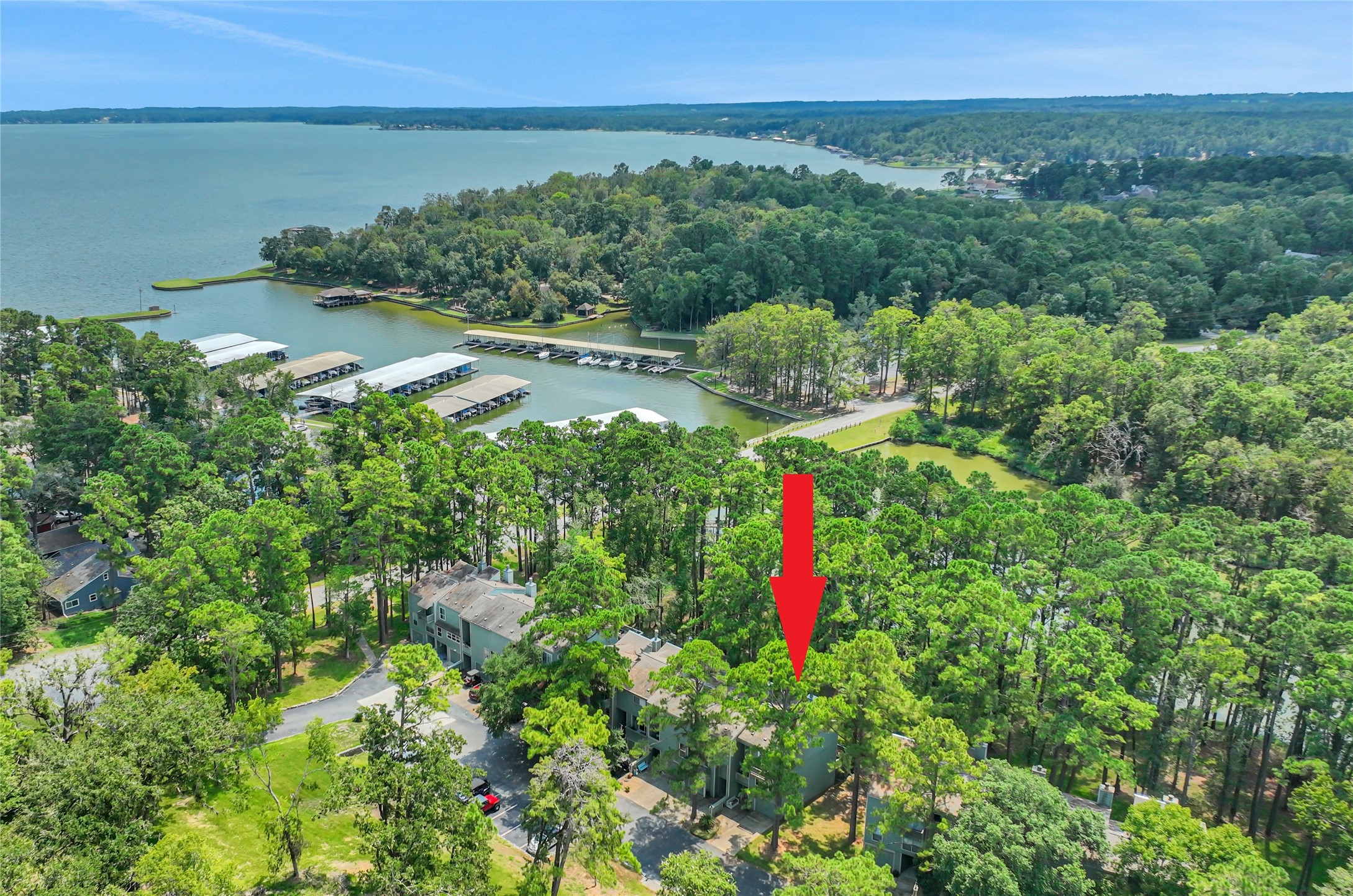 142 Villa Way Coldspring, TX 77331 - Photo 2 of 35 The townhomes are located right by Cape Royale marina - providing views of the lagoon, marina and the lake beyond!