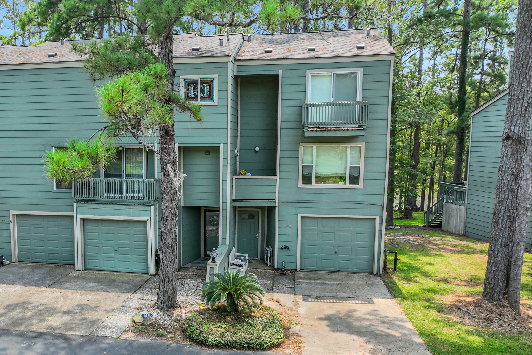 142 Villa Way Coldspring, TX 77331 - Photo 24 of 35 There is a one car garage, private parking and additional spaces for guests in front of the townhomes