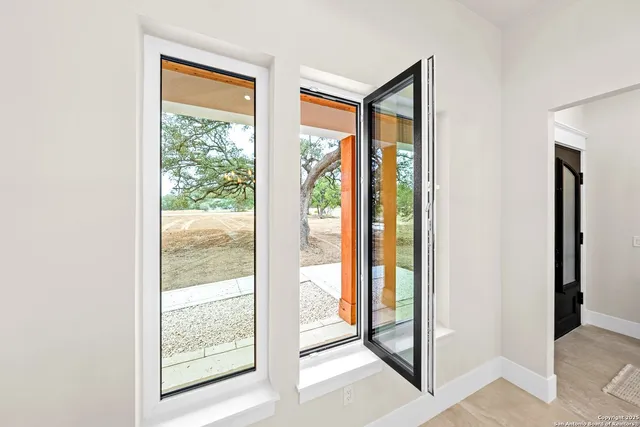 a living room with furniture and window