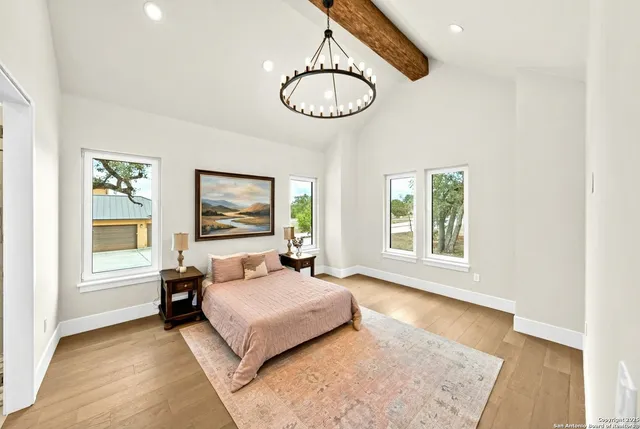 a bathroom with a double vanity sink tub and mirror