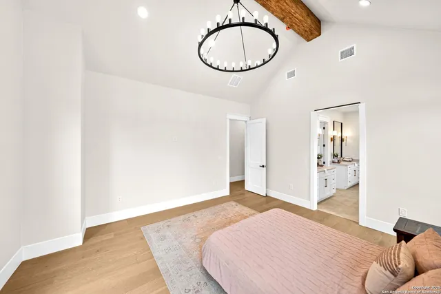 a spacious bathroom with a granite countertop tub sink and mirror