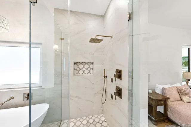 a spacious bathroom with a bathtub and shower