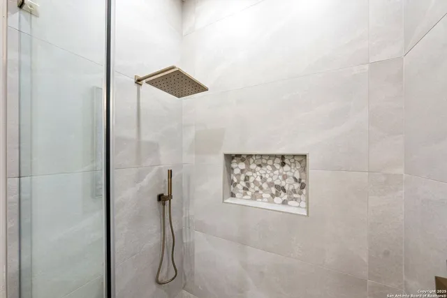 a bath tub sitting next to a white sink