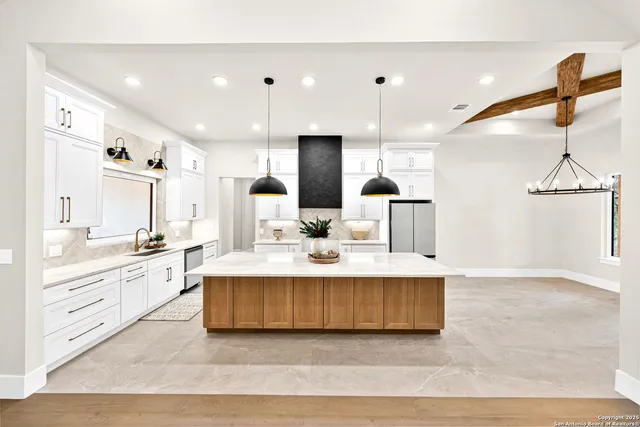a kitchen with a cabinets window and sink