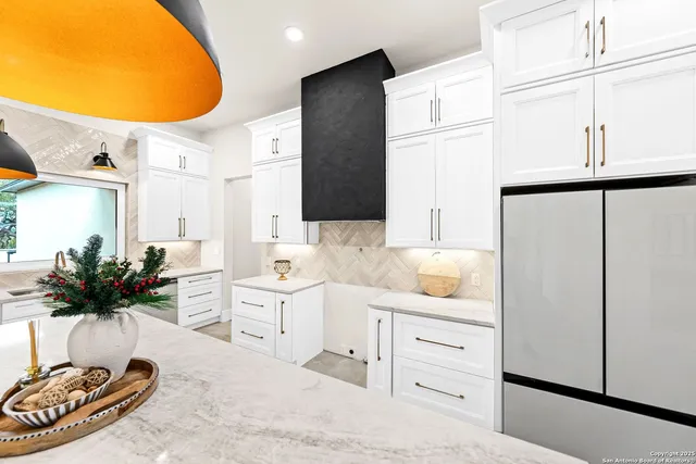 a large bathroom with a sink a large mirror and a shower