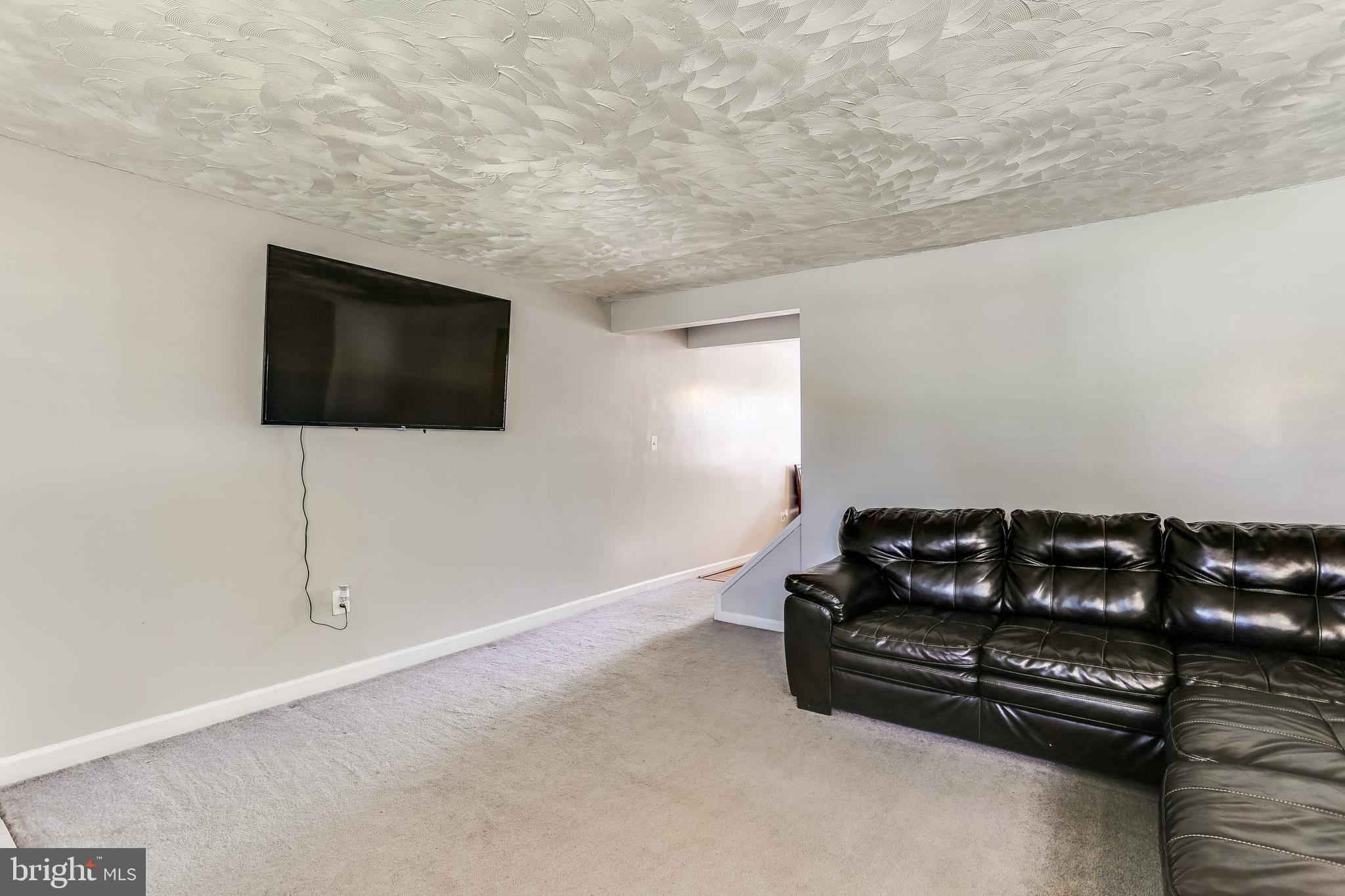 249 Stemmers Run Road Baltimore, MD 21221 - Photo 4 of 30 Living Room with Neutral Carpet