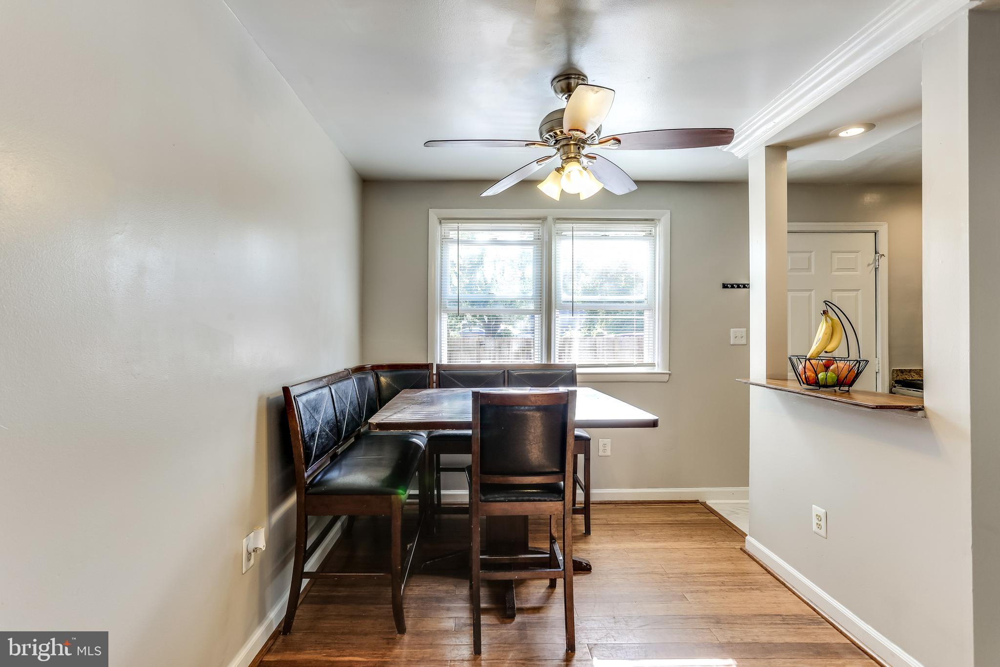 249 Stemmers Run Road Baltimore, MD 21221 - Photo 6 of 30 Hardwood Floor and Ceiling Fan