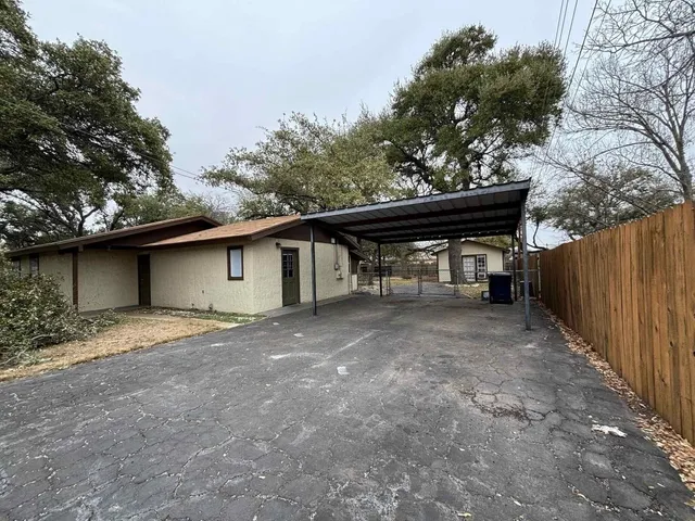 a view of a house with a yard and garage