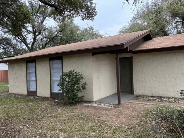 a backyard of a house with lots of green space