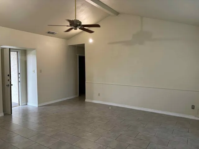 a view of a hallway with a chandelier