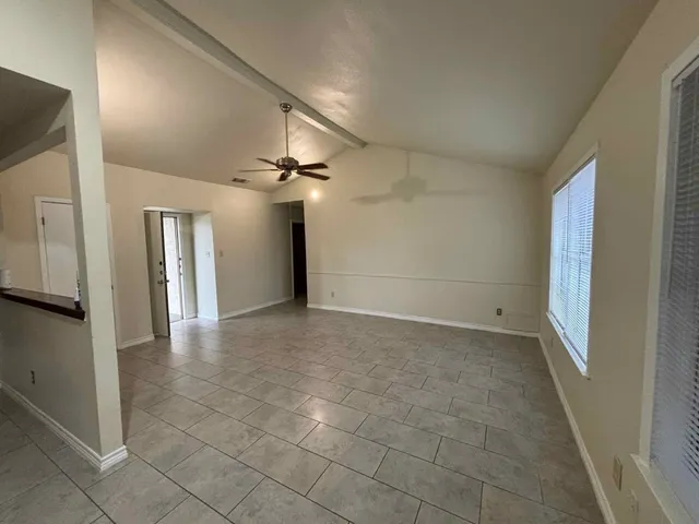 a kitchen with a sink a stove and cabinets