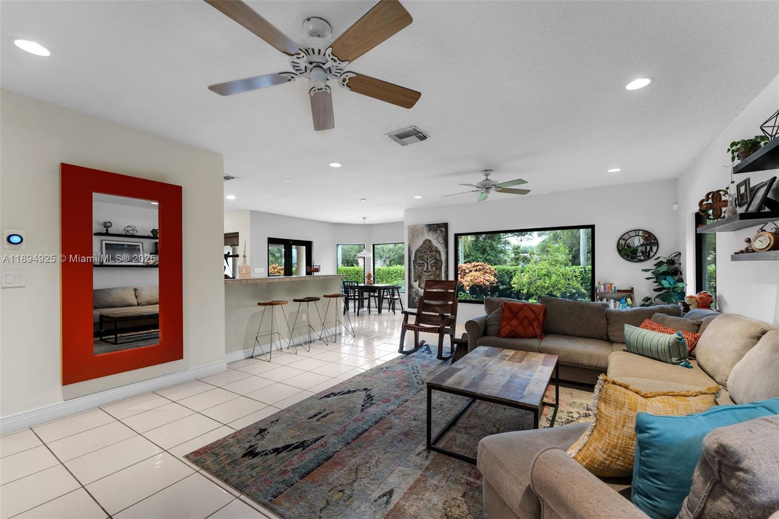 12019 Southwest 77th Terrace Miami, FL 33183 - Photo 15 of 67 a living room with furniture and a large window