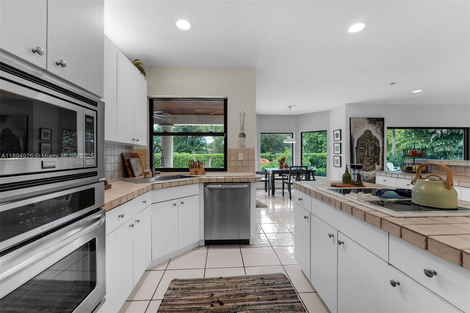 12019 Southwest 77th Terrace Miami, FL 33183 - Photo 20 of 67 a kitchen with sink and stove