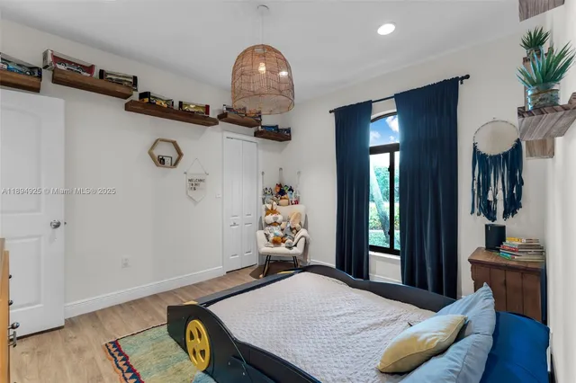 a view of a workspace with wooden floor