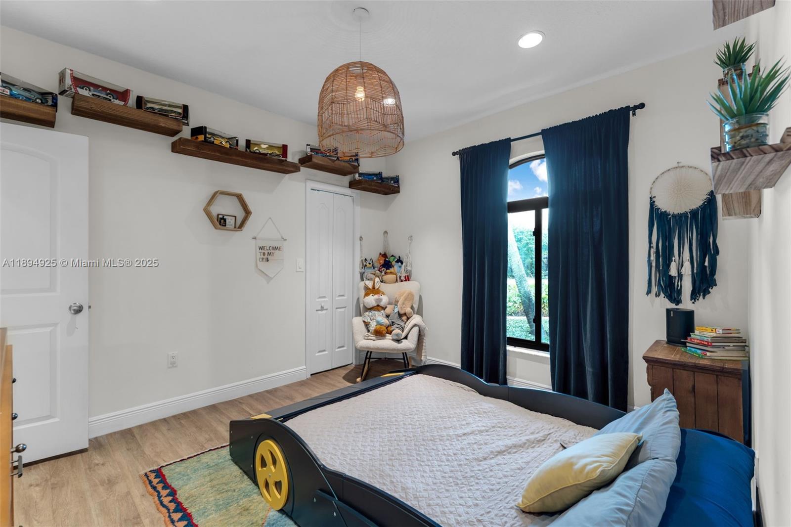 12019 Southwest 77th Terrace Miami, FL 33183 - Photo 23 of 67 a bedroom with furniture and a wooden floor