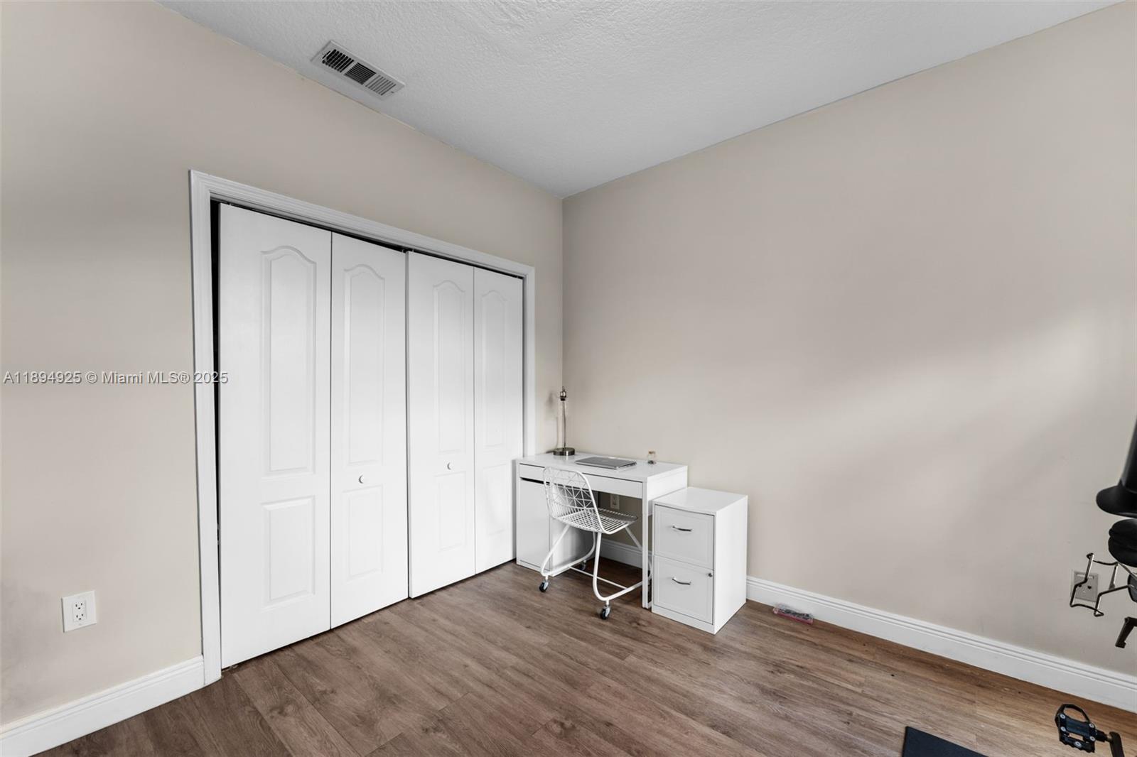 12019 Southwest 77th Terrace Miami, FL 33183 - Photo 29 of 67 a view of a workspace with wooden floor