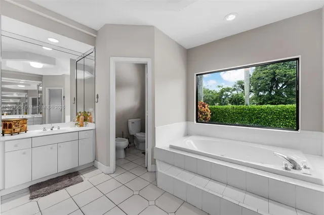 a living room with patio furniture and a yard