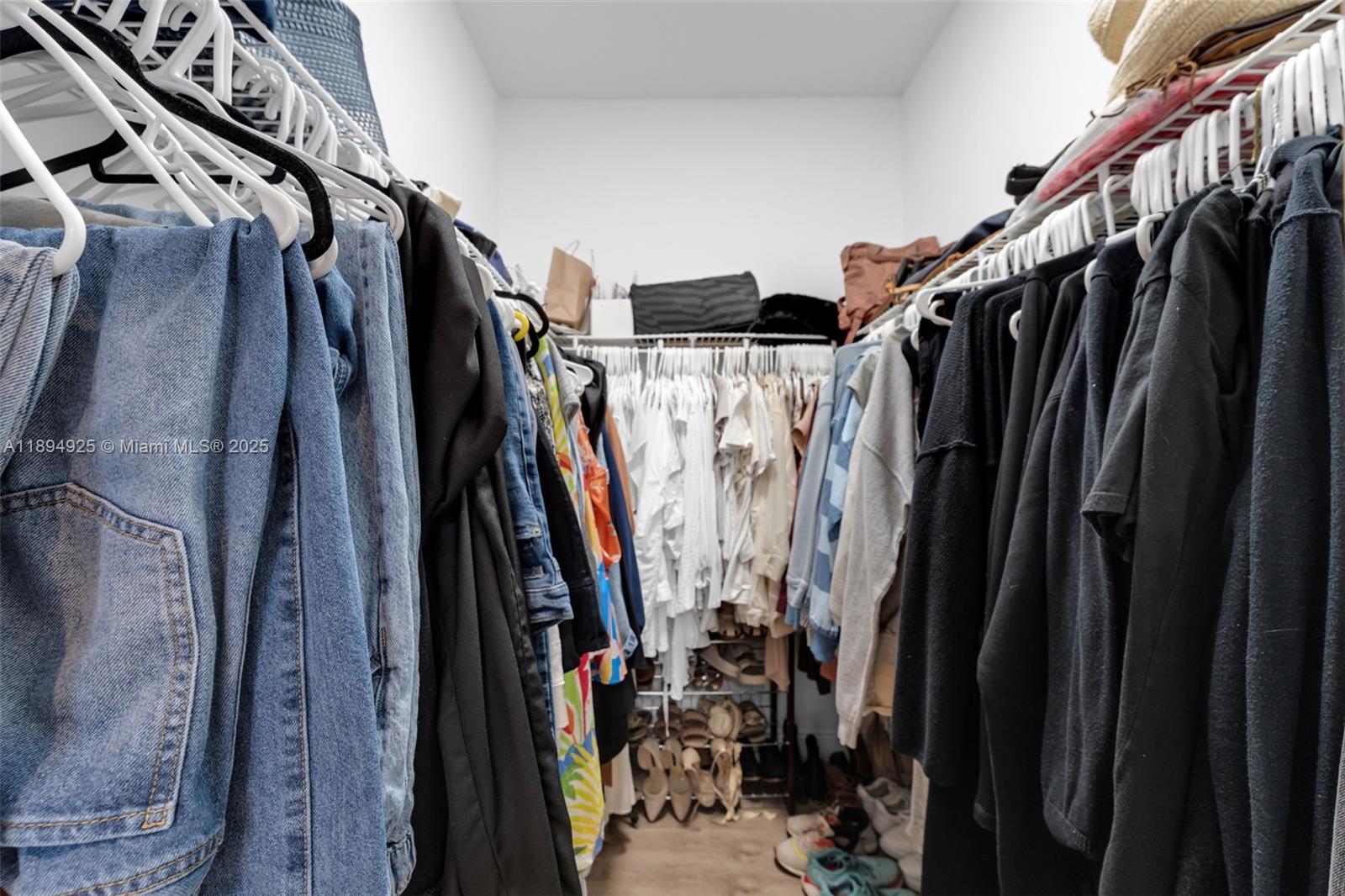 12019 Southwest 77th Terrace Miami, FL 33183 - Photo 33 of 67 a view of walk in closet with clothes