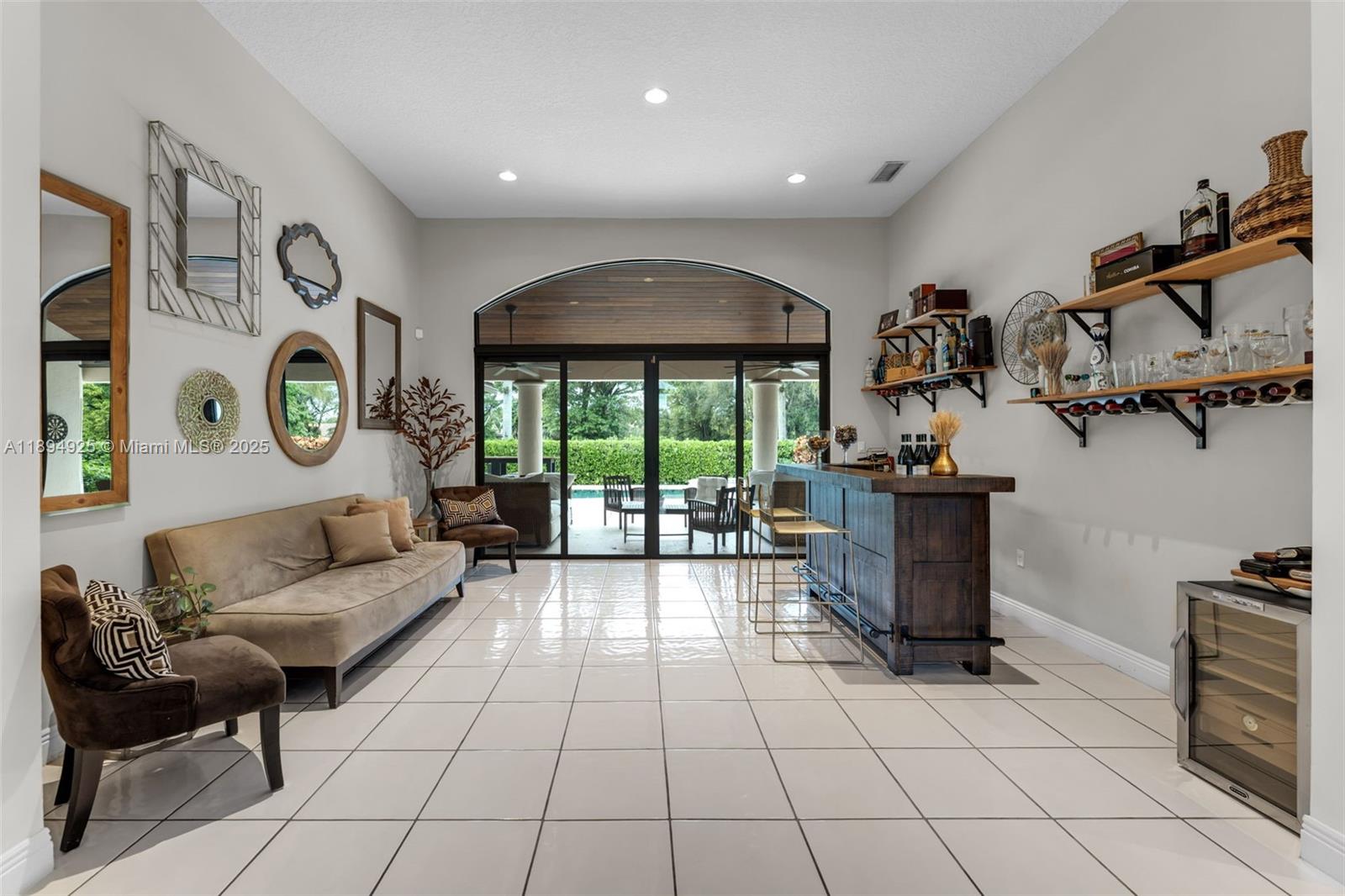 12019 Southwest 77th Terrace Miami, FL 33183 - Photo 4 of 67 a living room with furniture and a gate