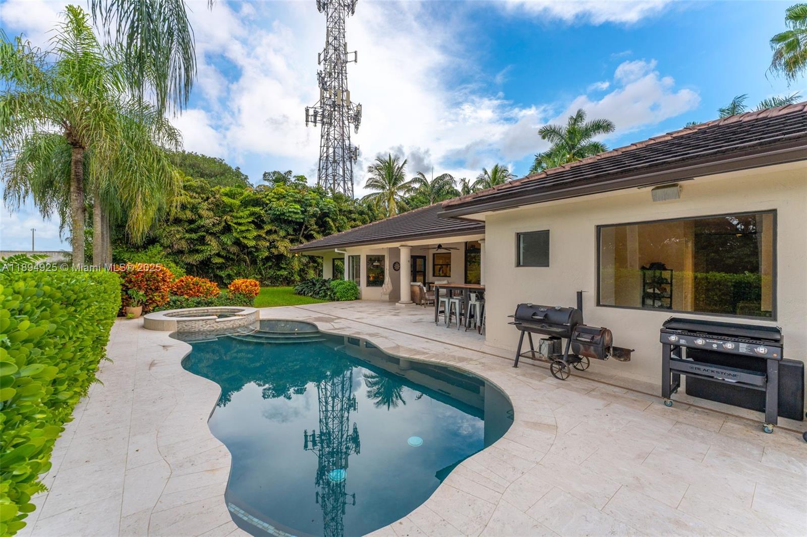 12019 Southwest 77th Terrace Miami, FL 33183 - Photo 44 of 67 a view of a house with swimming pool and sitting area
