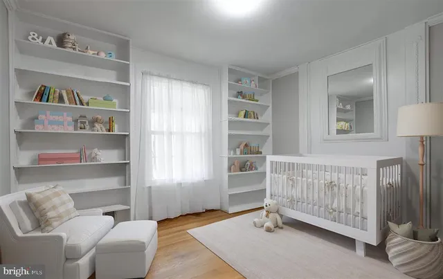 a bedroom with furniture and a window