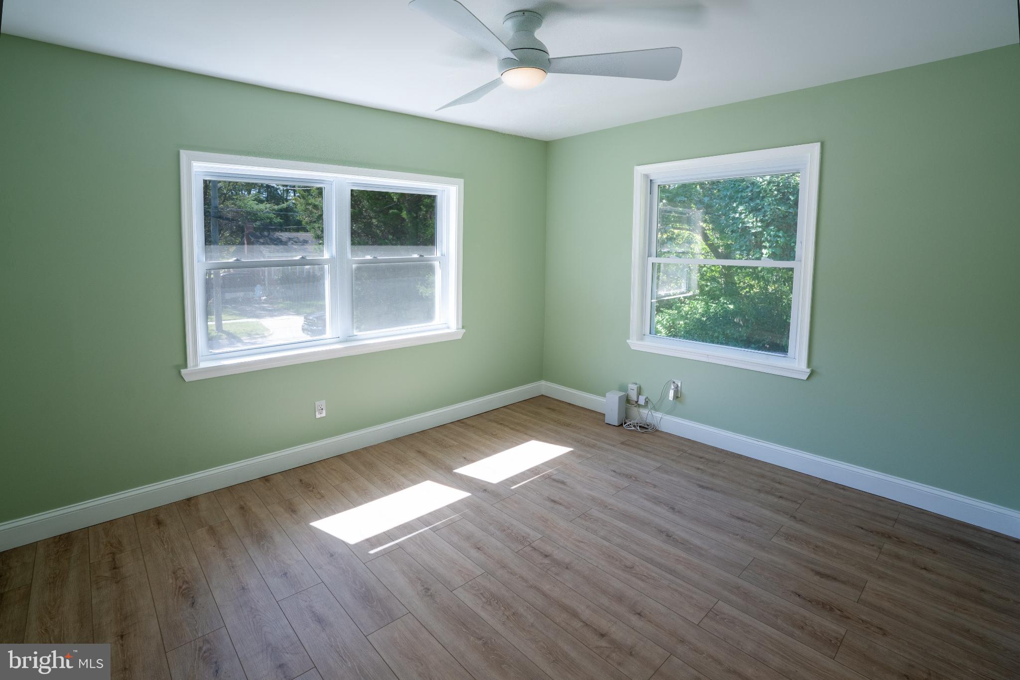 2652 Cory Terrace Silver Spring, MD 20902 - Photo 11 of 33 a view of an empty room with wooden floor and a window