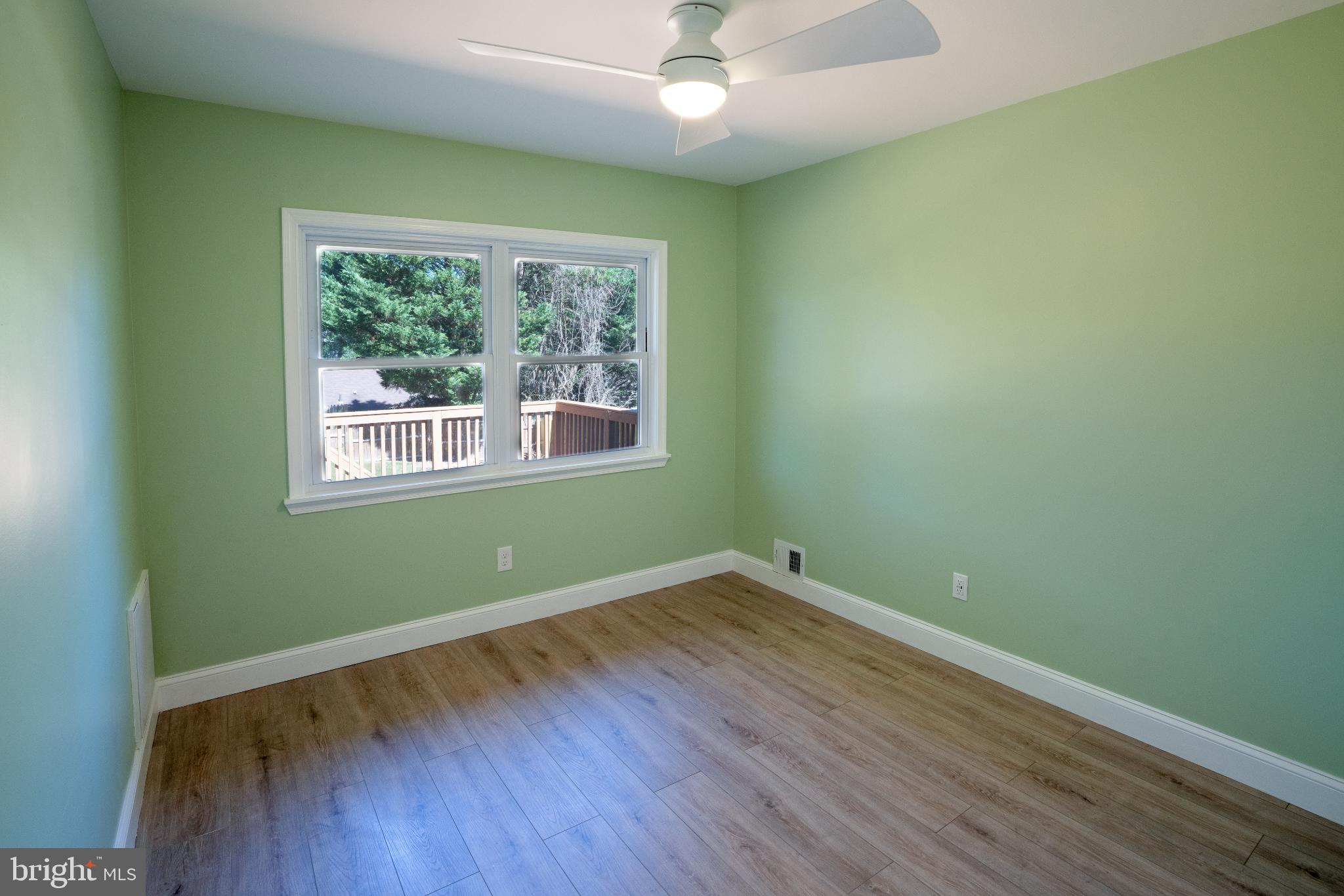 2652 Cory Terrace Silver Spring, MD 20902 - Photo 18 of 33 an empty room with wooden floor and windows