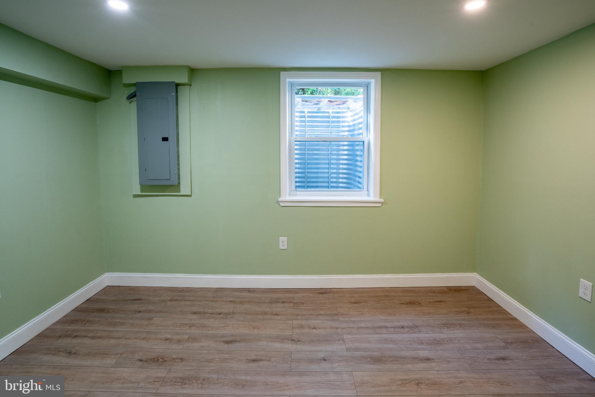 2652 Cory Terrace Silver Spring, MD 20902 - Photo 20 of 33 a view of a room with wooden floor and windows