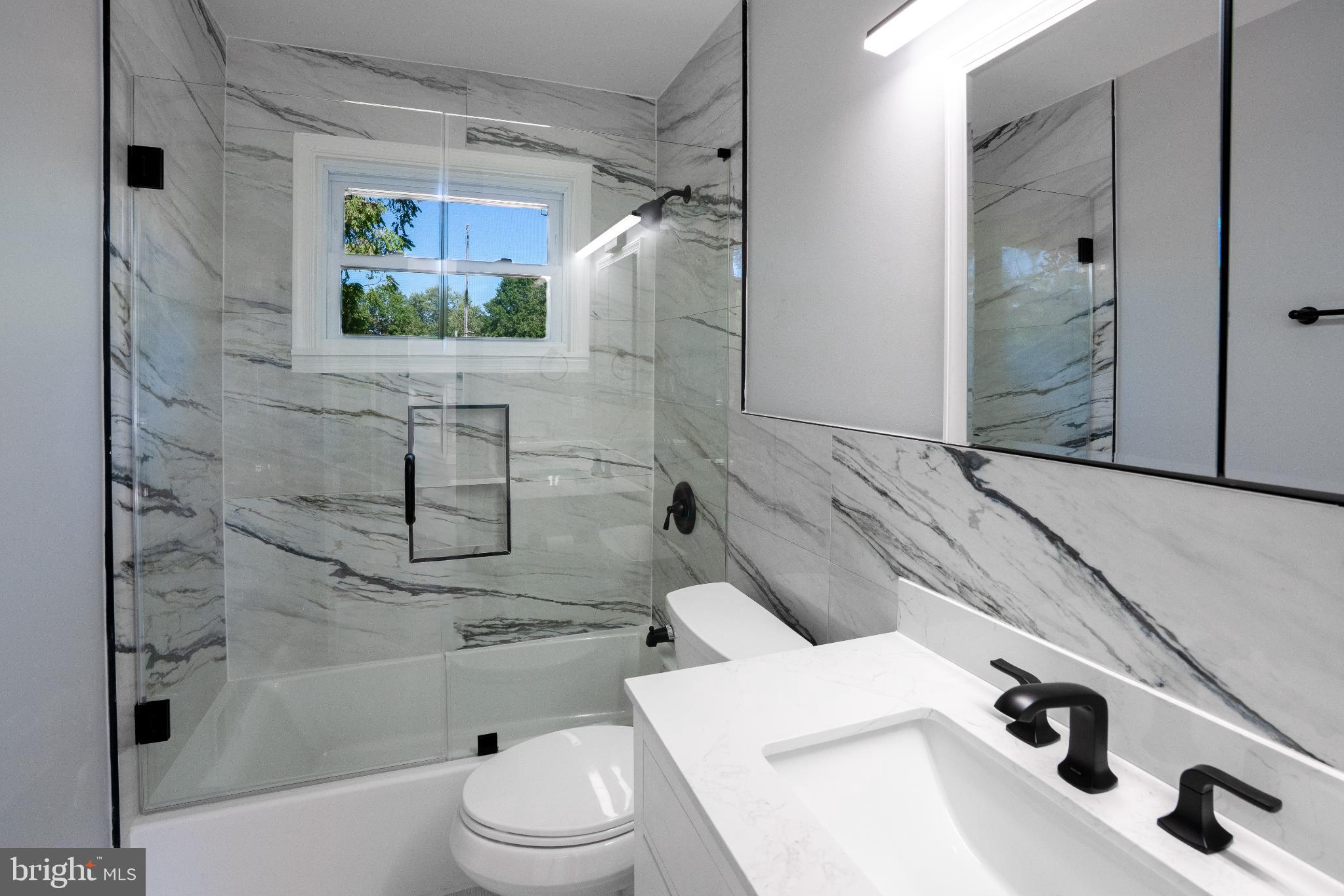 2652 Cory Terrace Silver Spring, MD 20902 - Photo 5 of 33 a bathroom with a sink toilet and shower