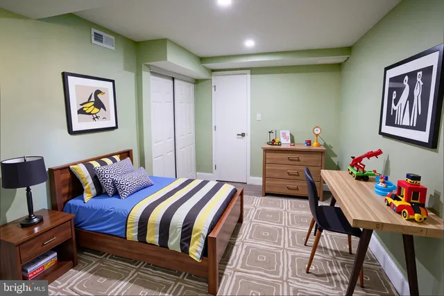 a bedroom with a bed and furniture