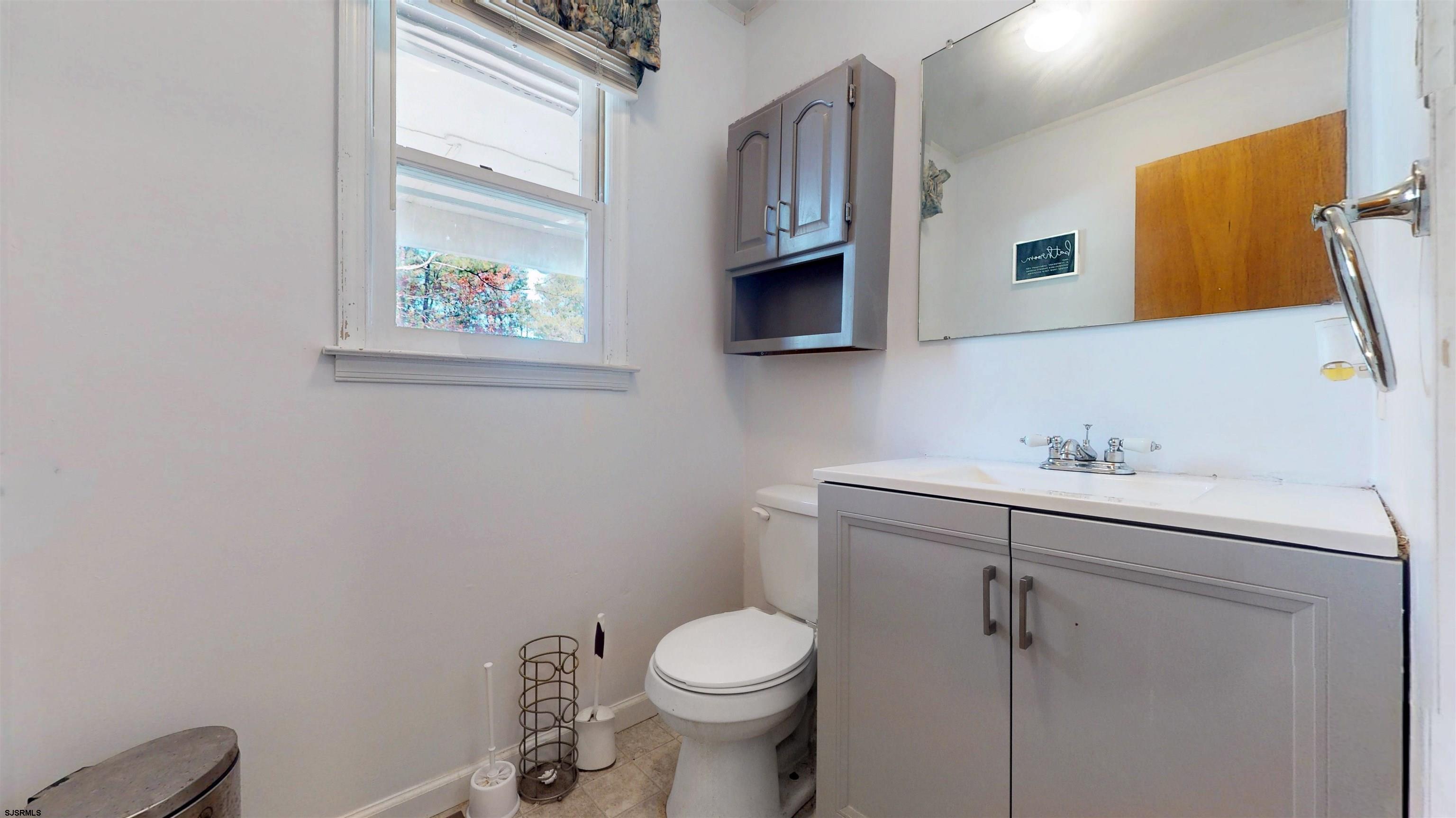 28 Luke Court Seaville, NJ 08230 - Photo 17 of 39 a bathroom with a toilet sink and mirror