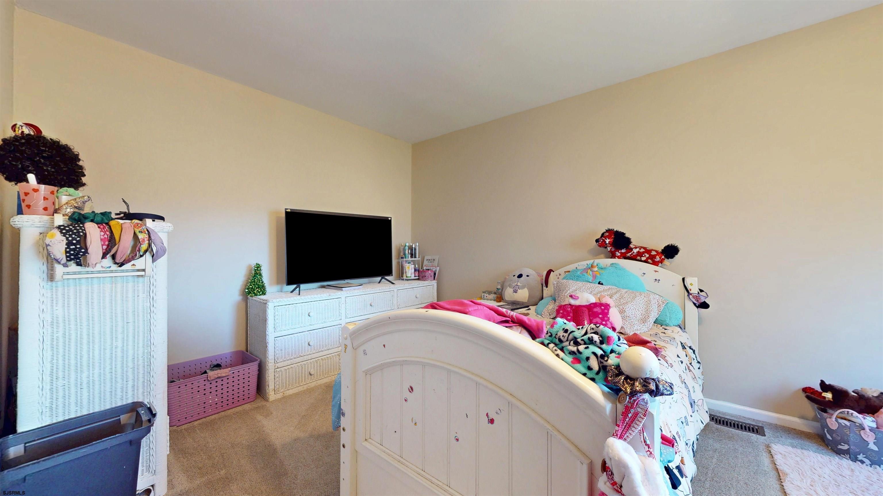 28 Luke Court Seaville, NJ 08230 - Photo 22 of 39 a bedroom with a bed and a flat screen tv