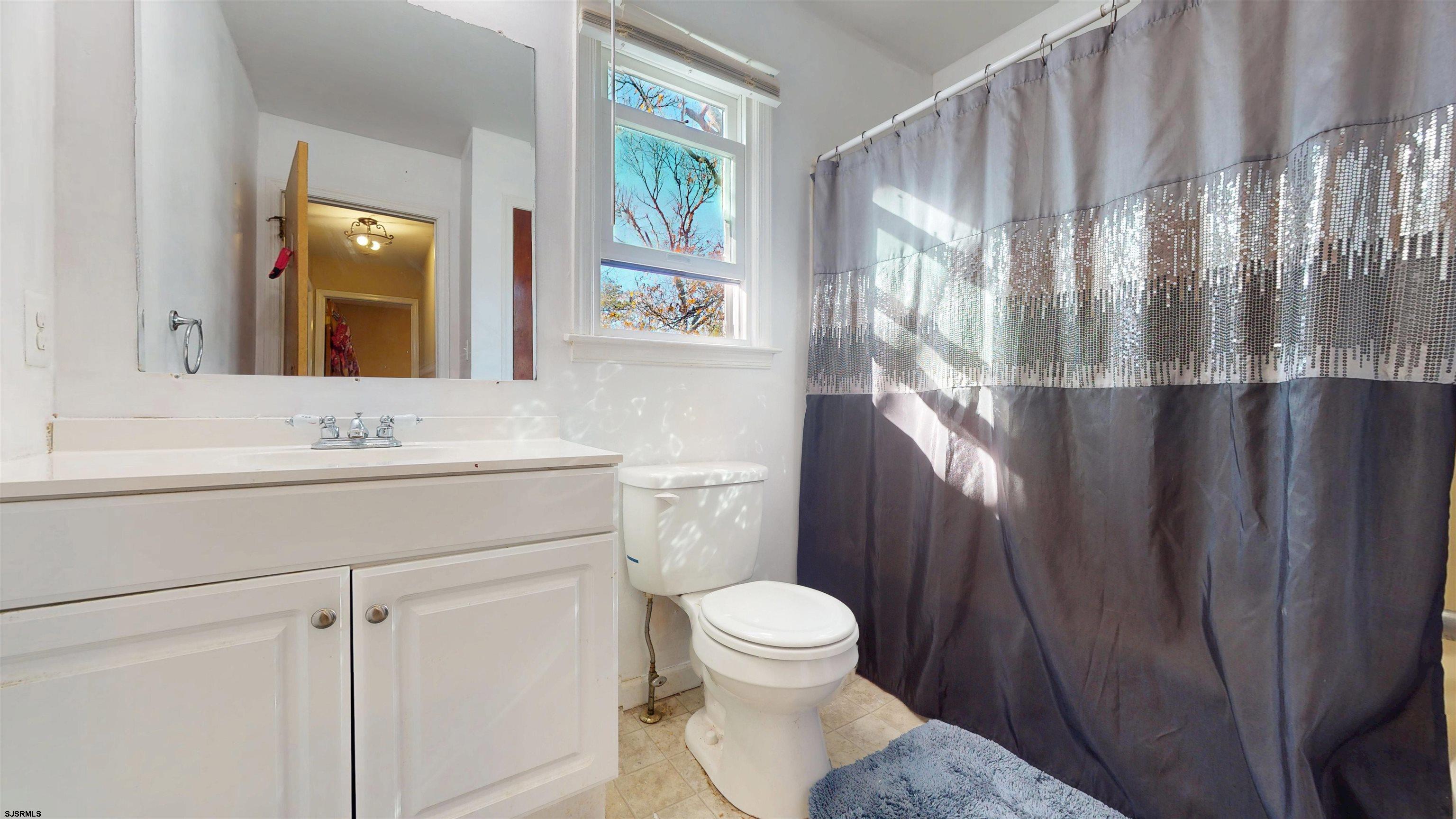 28 Luke Court Seaville, NJ 08230 - Photo 25 of 39 a bathroom with a toilet sink and mirror