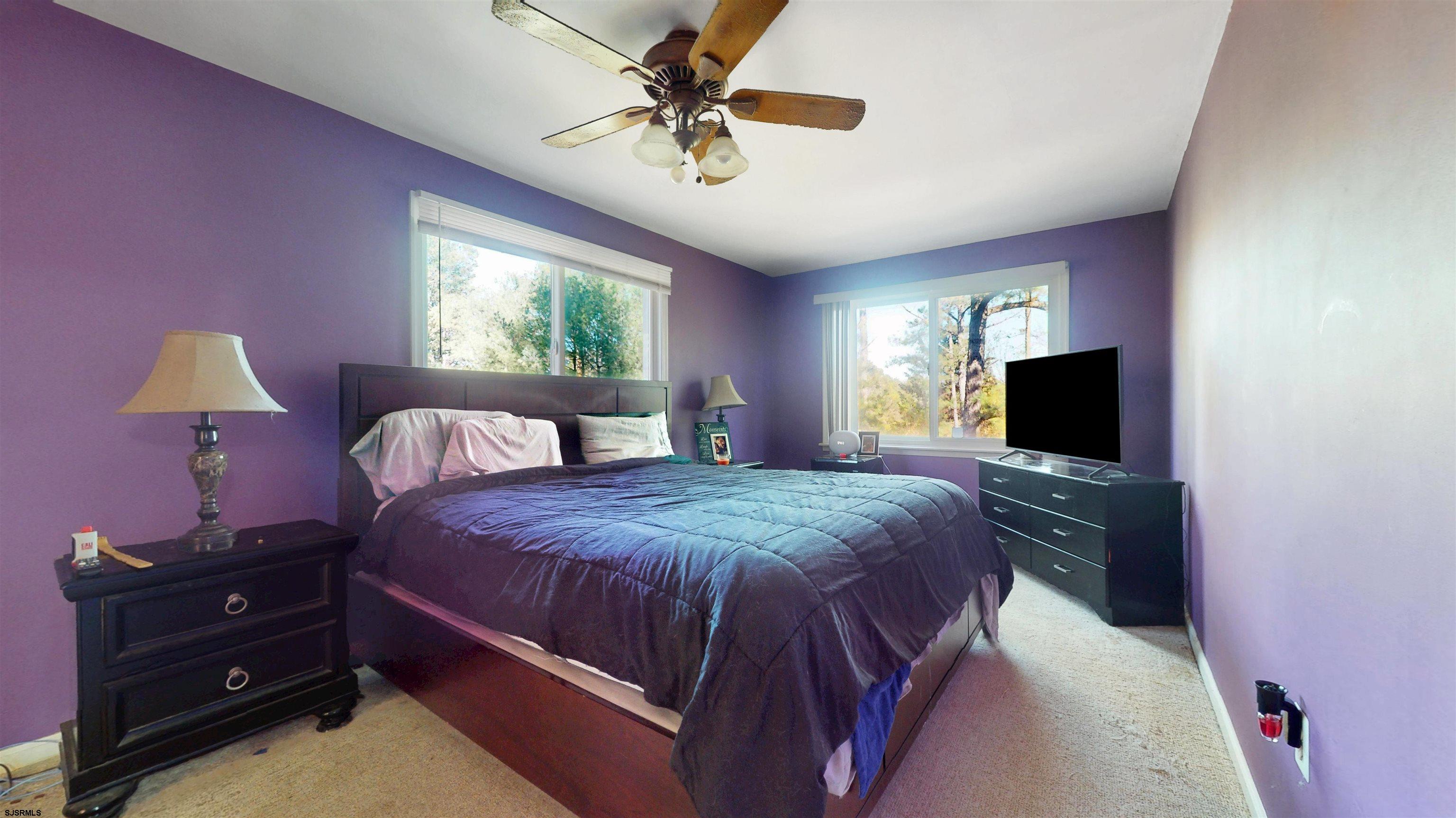 28 Luke Court Seaville, NJ 08230 - Photo 27 of 39 a bedroom with a bed and a chandelier
