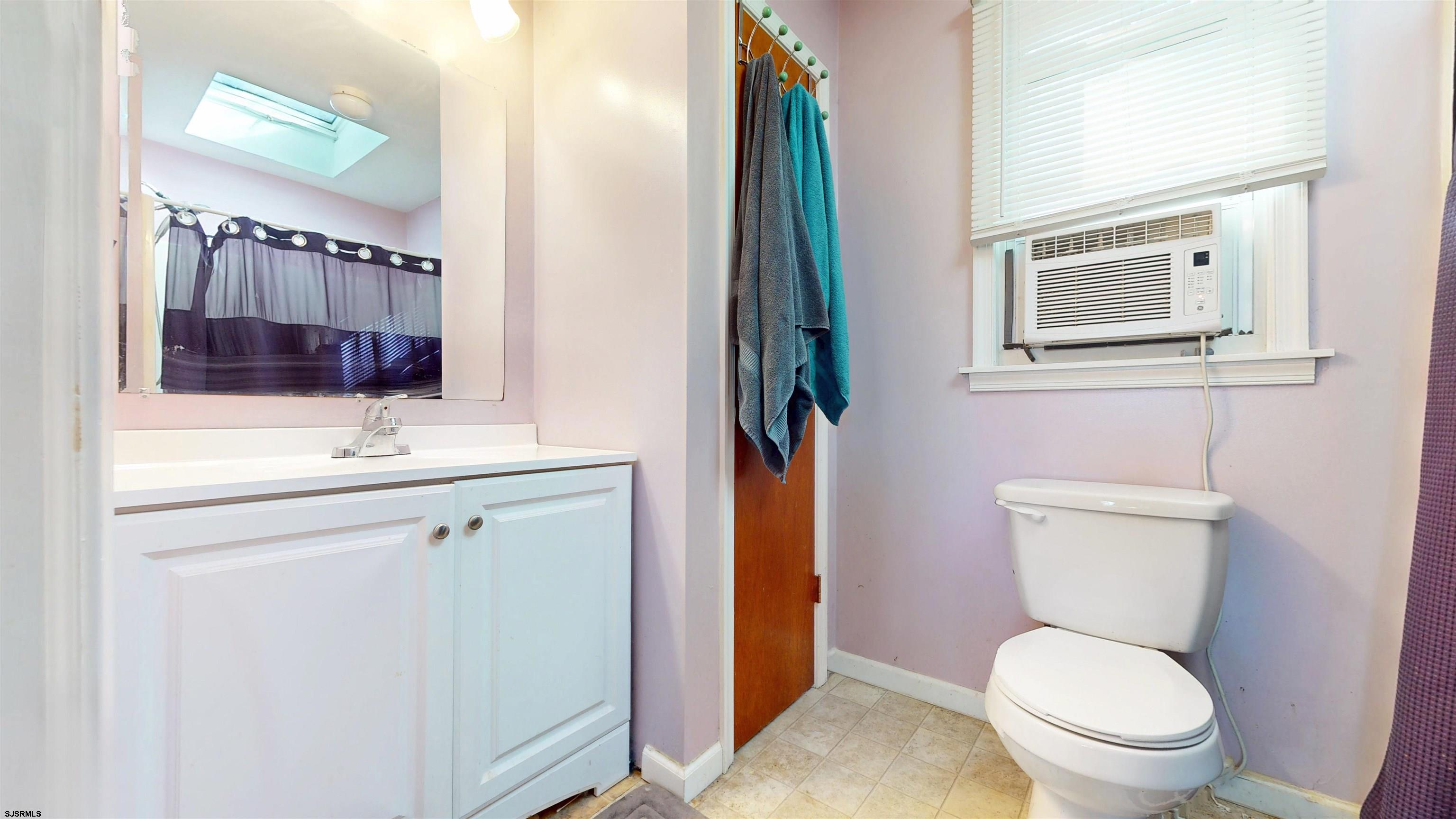 28 Luke Court Seaville, NJ 08230 - Photo 28 of 39 a bathroom with a toilet a sink and mirror
