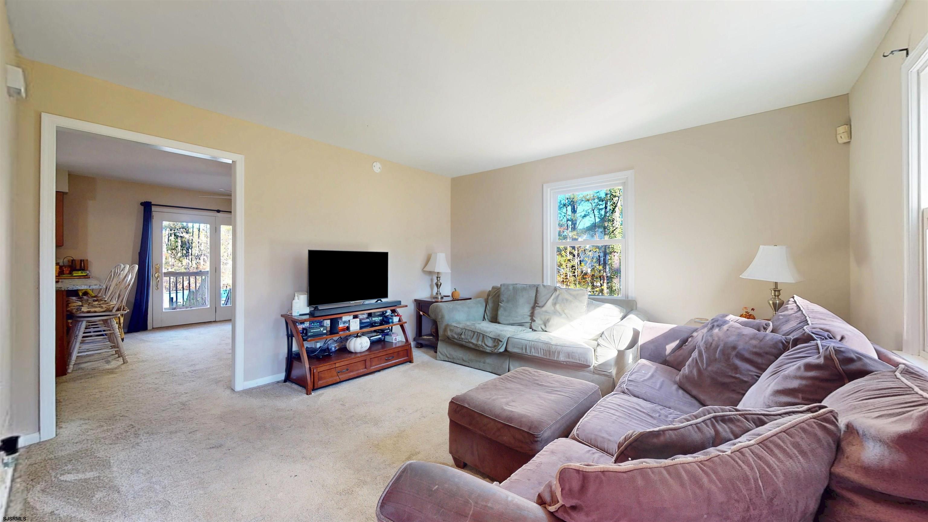 28 Luke Court Seaville, NJ 08230 - Photo 6 of 39 a living room with furniture and a flat screen tv