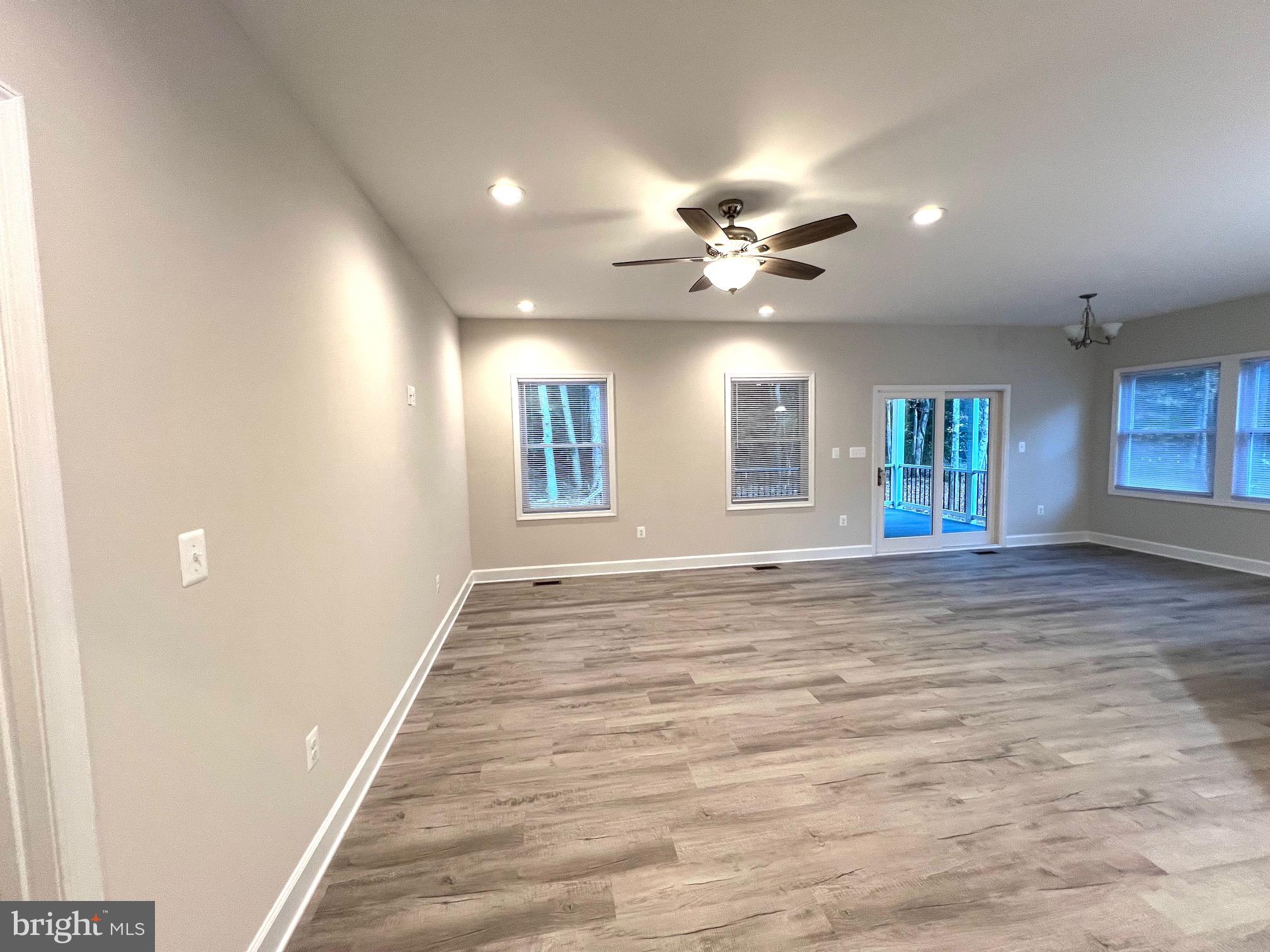 Tbd Lot 31 Tbd Colonial Beach, VA 22443 - Photo 25 of 53 en empty room with windows and ceiling fan