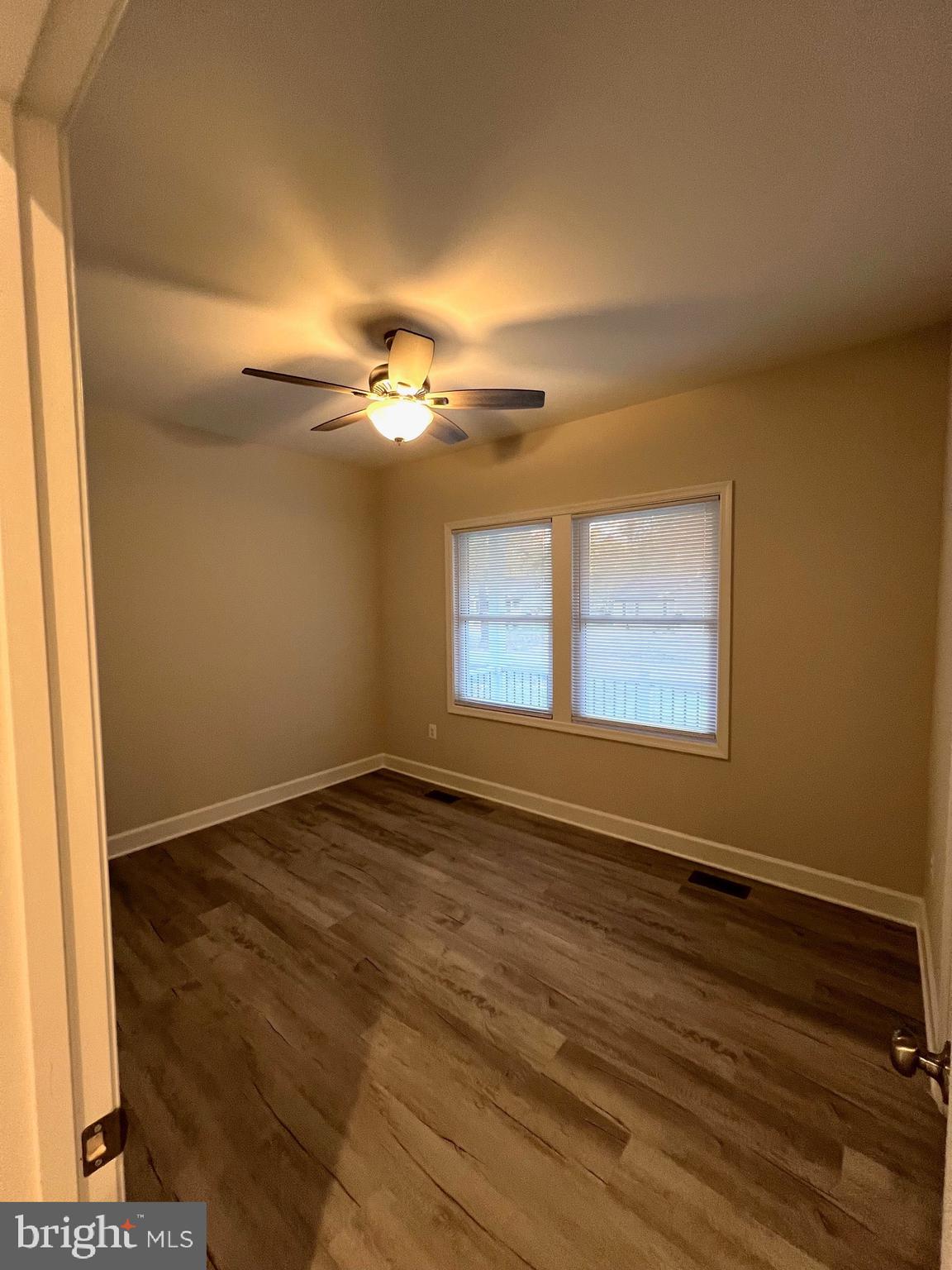 Tbd Lot 31 Tbd Colonial Beach, VA 22443 - Photo 31 of 53 a view of an empty room with wooden floor and a window