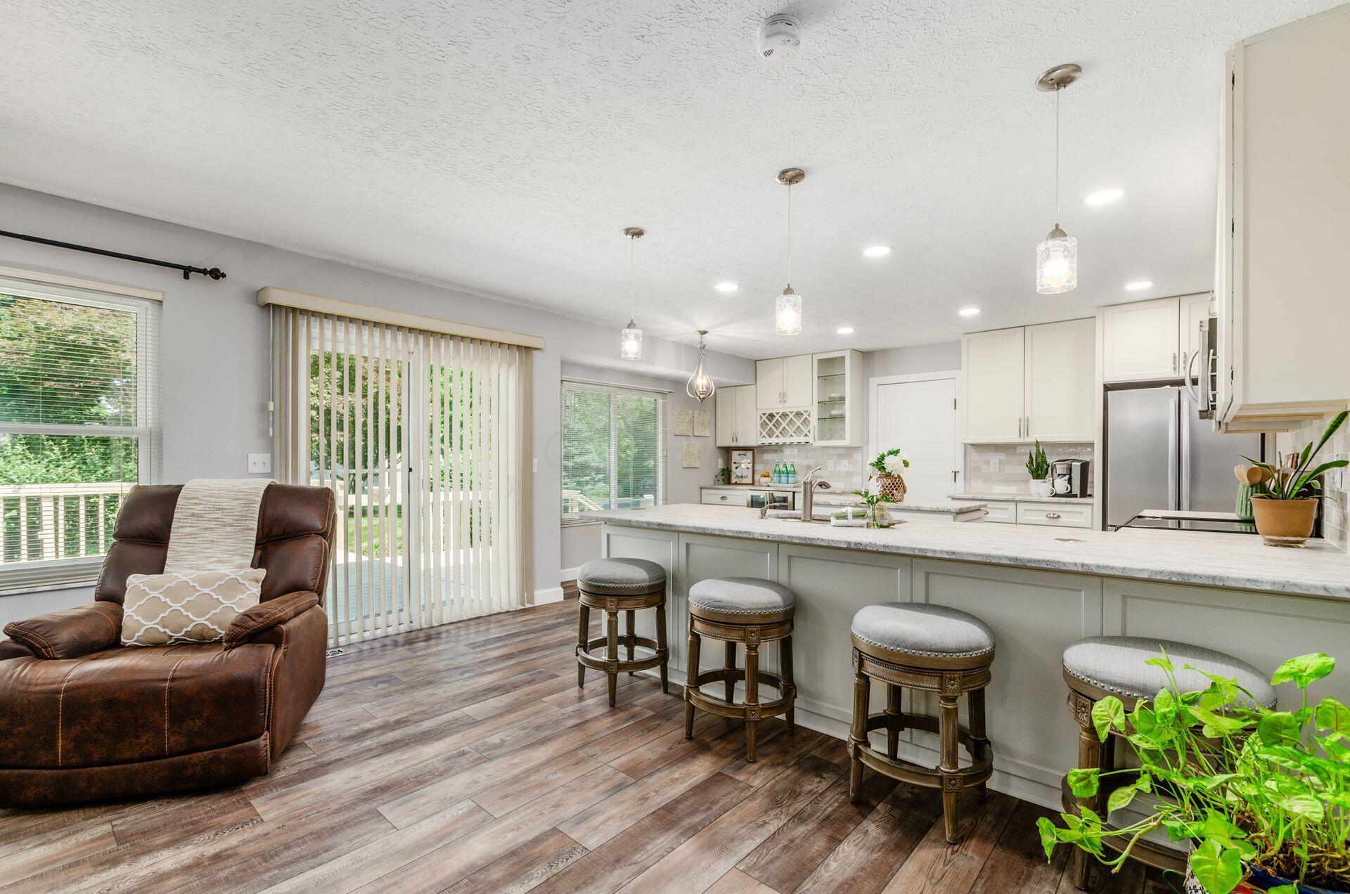 9471 Concord Road Powell, OH 43065 - Photo 11 of 40 OPENS TO THE REMODELED KITCHEN