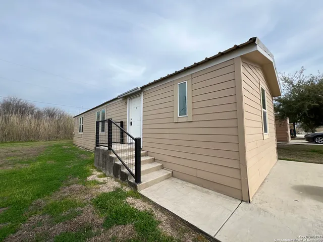 a view of backyard with green space