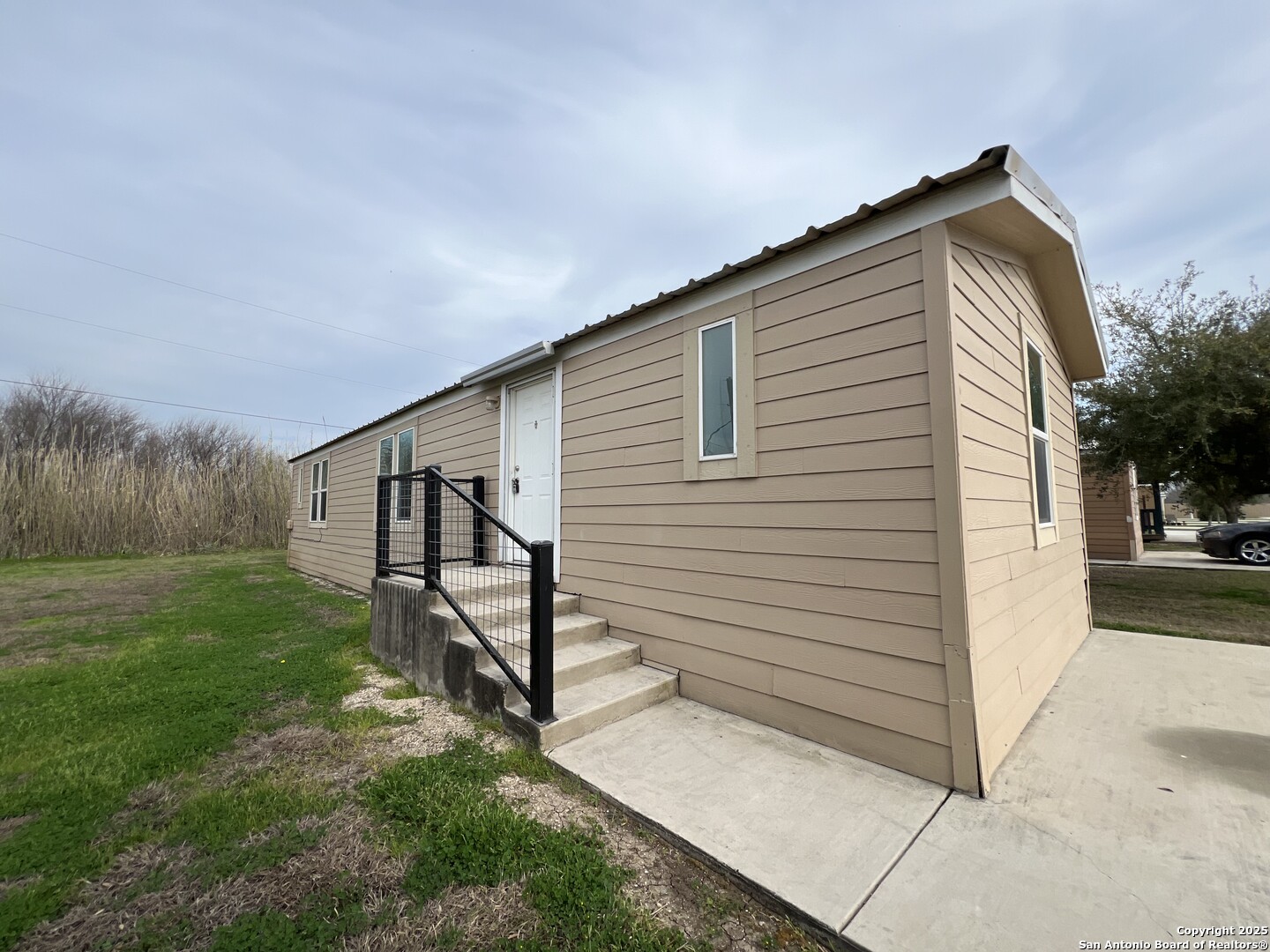 a view of backyard with green space