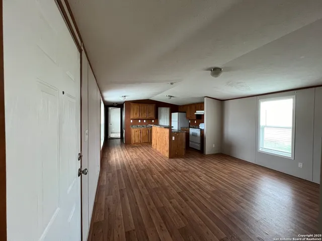 a view of a livingroom with wooden floor